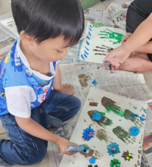 boy hand painting