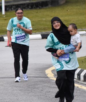 Family with baby running Family with baby running