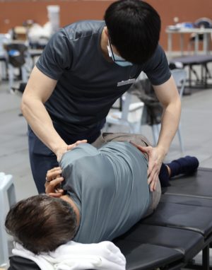 Dwayne adjusting a patient
