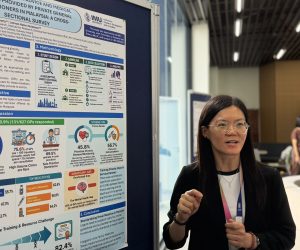 Dr Lai Presenting her poster